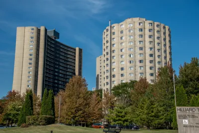 Round modernist concrete public housing towers with arched windows in Chicago, Illinois.