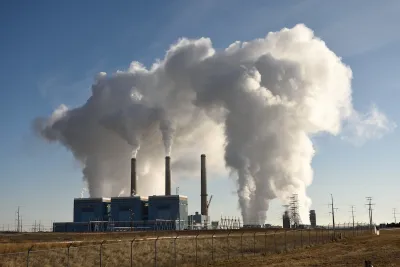 Smoke billows out of a power plant.