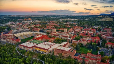 Serial view of large unversity campus in Boulder, Colorado at dusk.