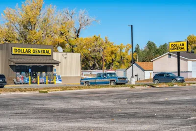 A Dollar General store with vontage truck parked in front in Atwood, Kansas.