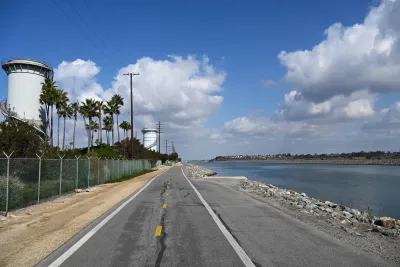 The Santa Ana River Trail, a paved road with a body of water to the right.