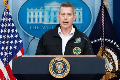 U.S. Transportation Secretary Sean Duffy speaking at a podium in front of American flag and White House logo on blue background.