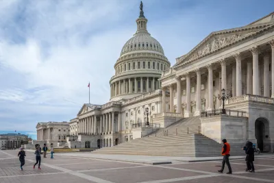 U.S. Capitol Dome in Washington, DC with a few people walking in front.