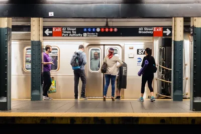 MTA subway train station platform with people traveling in New York on June 28, 2013.