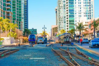 Train station in San Diego, California surrounded by tall buildings.