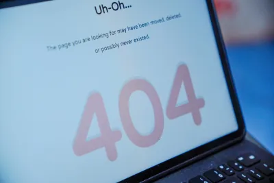Close-up of laptop screen with 404 error.