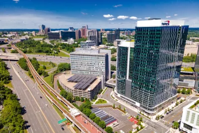 Aerial view of the city's architecture, Tysons Corner, skyscrapers and metro station.