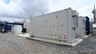 Large battery storage system in industrial setting.