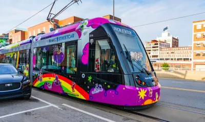 Colorful pink Kansas City streetcar.
