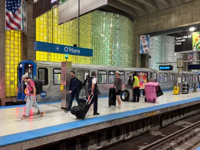 Busy train platform for subterranean Chicago O'Hare airport station.