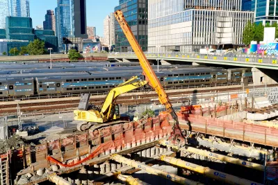 Construction on Gateway Tunnel with large yellow crane in New York City.