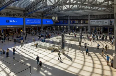 Passengers in Moynihan Train Hall at Penn Station in New York City.