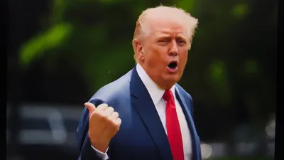 Donald Trump wearing blue suit and red tie.