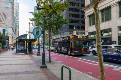 Red bus lane on busy street in Philadelphia, Pennsylvania.