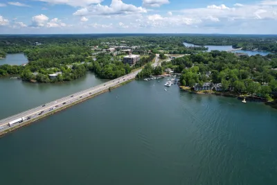 An aerial view of Interstate 77 crossing a body of water.