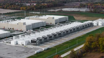 A data center. It is a low, white building, seen from above.