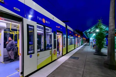 TriMet train at a platform at nighttime.