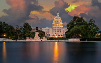 The United States Capitol Building at sunset, as seen from across the reflecting pool.