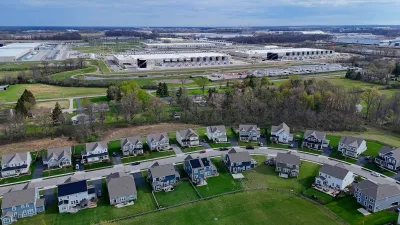 Suburban houses in front of a data center