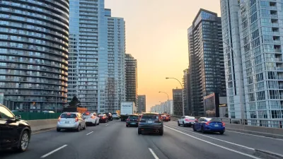 An elevated highway in Toronto surrounded by tall apartment buildings