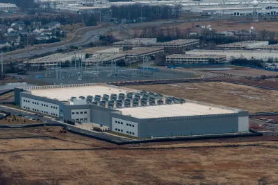 A data center next to homes and vacant land in Dulles, Virginia.