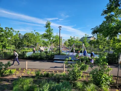 Playground at the Obama Center in Chicago visible behind fence.