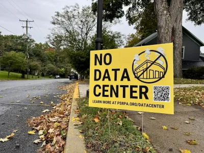 A yellow sign on the side of the road reads "NO DATA CENTER"