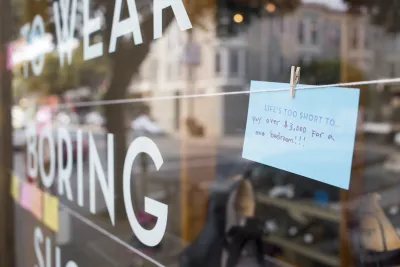 Sign in a window stating "Life's Too Short To Pay Over $3,000 for a bedroom" which signifies the rent crisis in San Francisco due to the technology boom & lack of housing forcing rent prices upwards.