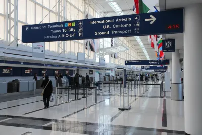 British Airways ticketing booths in mostly empty hall at Chicago airport.