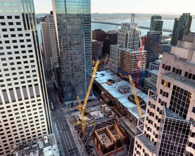 View looking down on construction of multiple buildings in San Francisco's Transbay Transit Center District