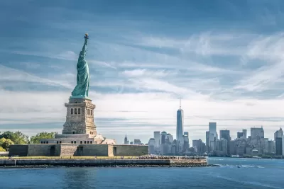View of Statue of Liberty with New York City skyline in background