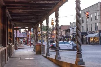 View down covered sidewalk in historic Stockyards district in Fort Worth, Texas