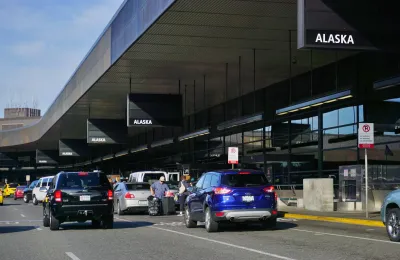 Cars pulling in at SeaTac airport drop-off area.