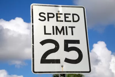 25mph speed limit sign against blue sky with white clouds