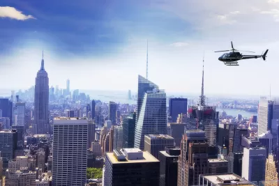 Helicopter flying over New York City with Empire State Building visible on left