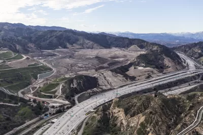 Aerial view of I-5 freeway and large landfill in hilly part of Los Angeles County