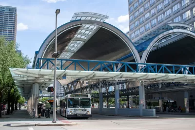 Downtown Houston covered bus station with one parked bus