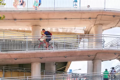 Bike rider on multi-tiered Philadelphia bridge