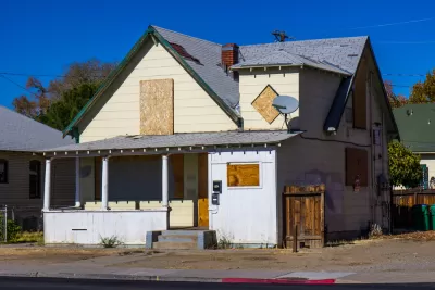 Boarded up, vacant house