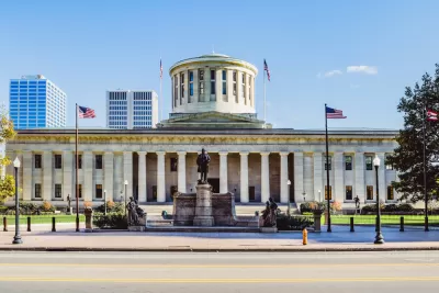 View of Ohio Statehouse with statue 