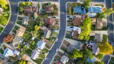 Aerial view of a single-family neighborhood with trees.