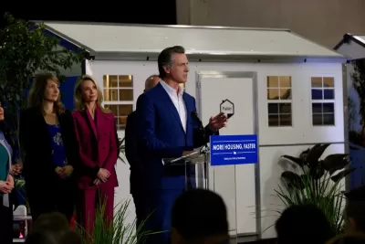 California Governor Gavin Newsom announcing funding for tiny home shelter project in front of quick-build tiny home shelter unit.