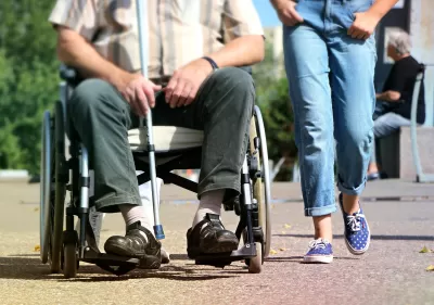 Wheelchair user on sidewalk