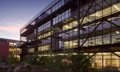 University of Arizona Campus building with glass windows and dark railings taken during dusk