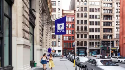 NYU Wagner profile image of a street with a sign that has NYU Wagner's purple and white Logo