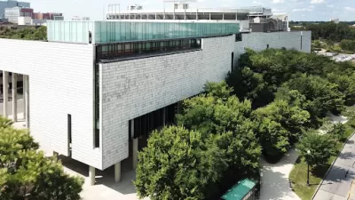 Image of white building and trees plus shrubbery at the Ohio State University