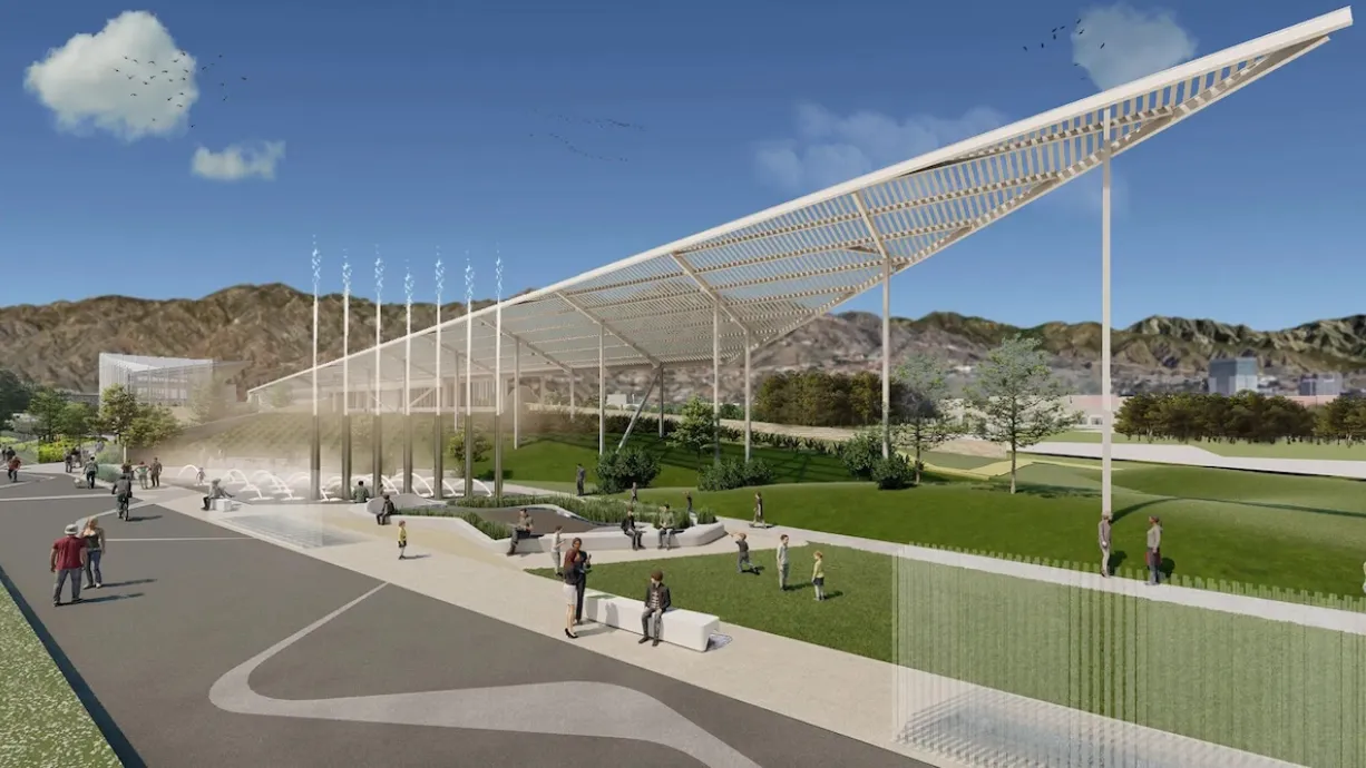 A rendering of the proposed green space, which has a white, triangular structure that provides shade, and small waterfalls.
