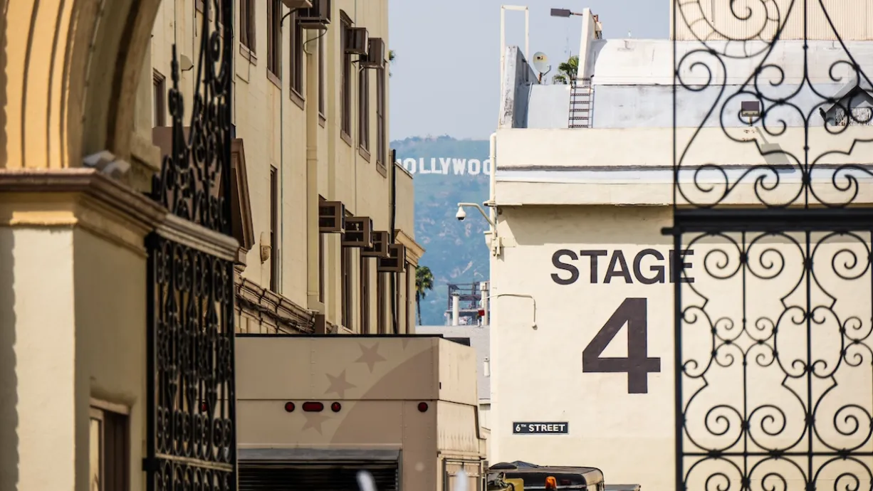 "Stage 4" soundstage wall seen through ornate metal gate at Paramount Studios lot in Los Angeles, California.