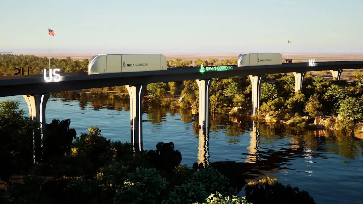 Rendering of autonomous cargo train moving across bridge across river in wooded area between Texas and Mexico.