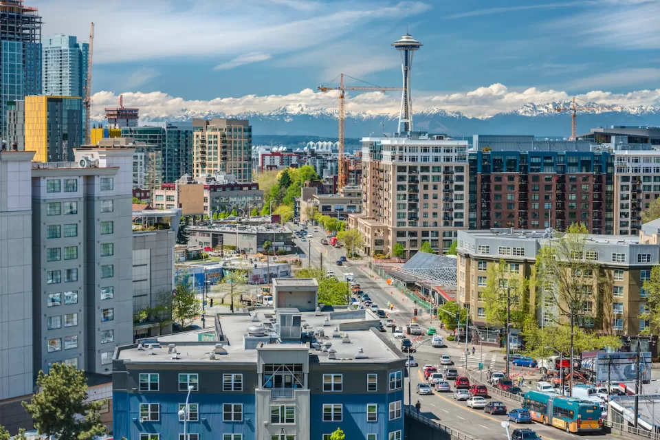 View of downtown Seattle with Space Needle and mountains in background